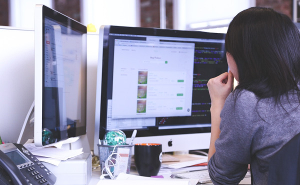 A web designer sitting at desk